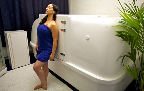 Woman by a Restingwell floatingtank Woman by a Restingwell floatingtank